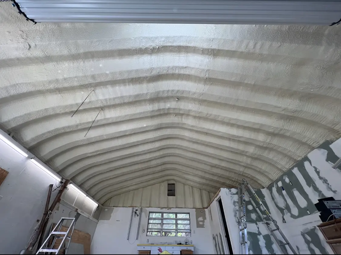 Spray polyurethane foam applied to the underside of a metal roof deck in King City